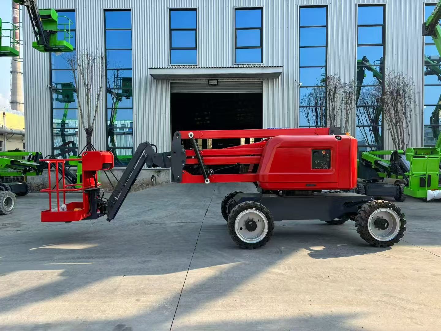 Compact electric articulated boom lift